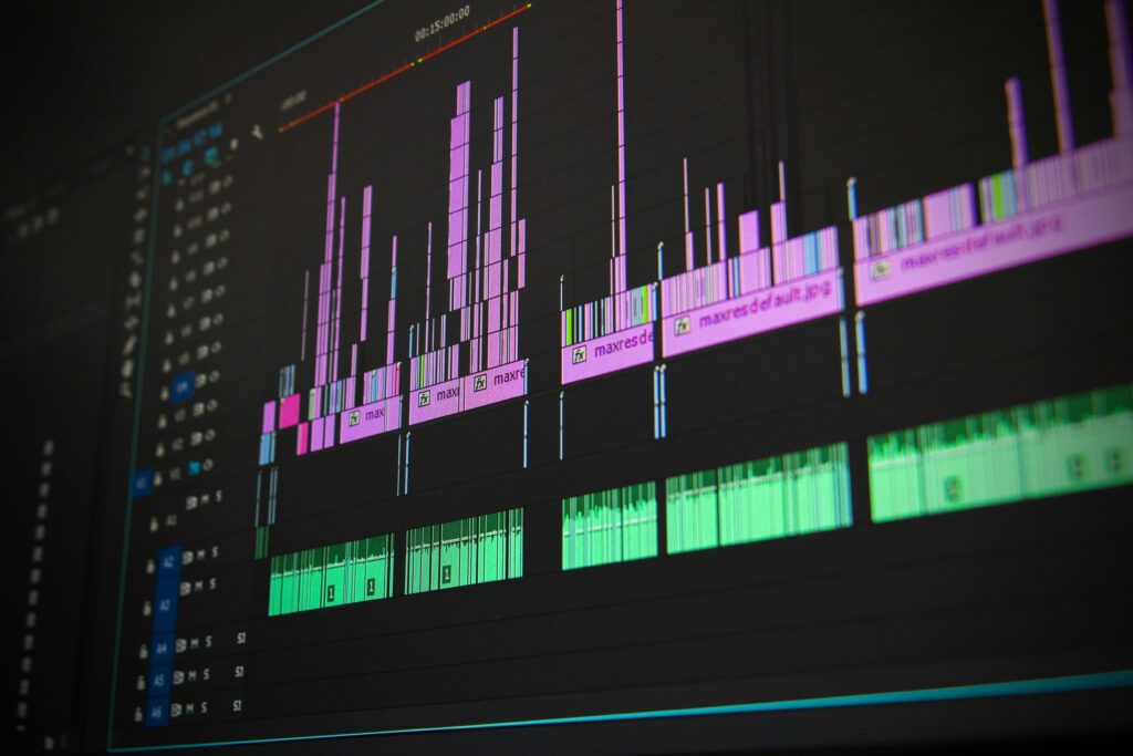 pexels photo 257904 257904 Close-up of a professional audio and video editing software interface with waveform displays.